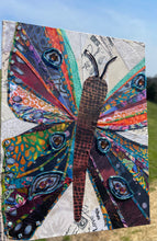 Original mixed media butterfly artwork 9x12 inches, butterfly with patchwork fabric wings in teal, orange, crimson and plum with Czech glass bead eye markings and bead antennae, vintage paper ephemera background with handwritten text and words love magic bright, on birch panel, part of the Floral and Botanical and Whimsical Companions Collections