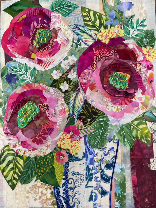 Floral fabric mixed media wall art with layered colorful flowers and lush botanical textile collage