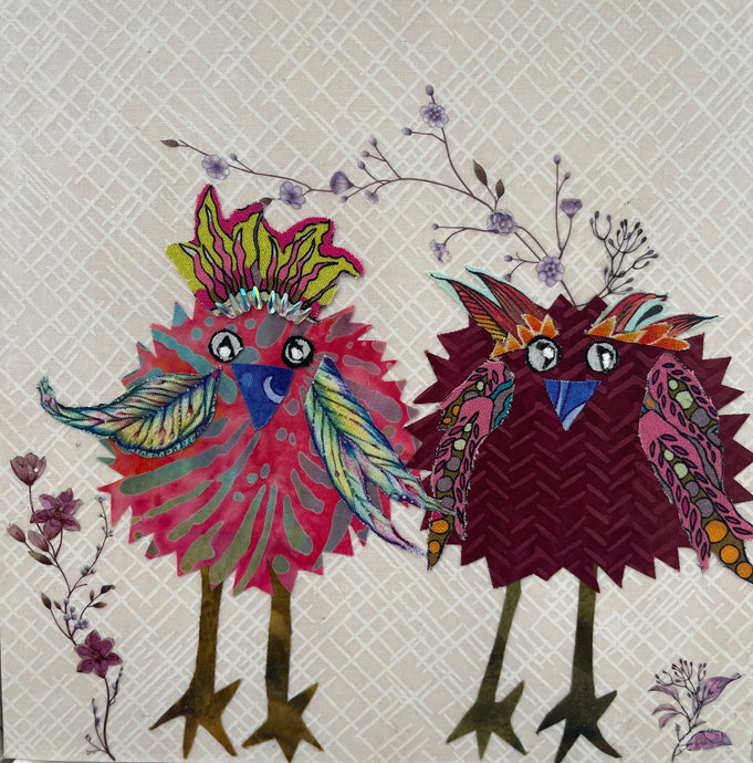 Whimsical bird artwork made with layered fabric and mixed media, featuring companion birds in soft neutral and blue tones with textured stitched looking details