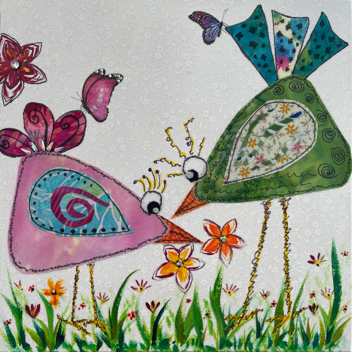 Whimsical bird artwork made with layered fabric and mixed media, featuring two birds in close composition in soft green and pink tones with textured stitched  looking details