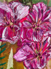 Close-up of textured pink flowers with pink center embellishments.
