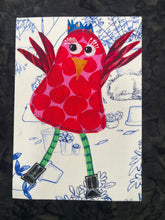 Quirky red  and pink fabric collage bird with raised wings, green legs, and black boots on a softly illustrated background