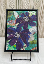Original clematis flower fabric collage artwork 9x12 inches, two purple and blue batik blooms with Swarovski crystal vine trim, black and white beaded centers, teal patchwork background, birch panel, Floral and Botanical Collection, Robyn Moore Arts