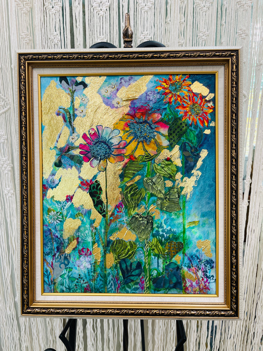 Framed abstract sunflower artwork with green fabric leaves and gold foil