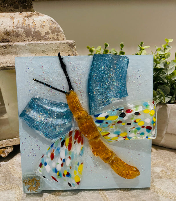 Colorful butterfly resin artwork with glass body and wings featuring multicolored patterns and shimmering texture