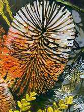 Close detail of texture paste dimensional surface on original acrylic botanical painting Where Earth Holds Light by Robyn Moore Arts, showing one dimensional banksia bloom form built up with texture paste in warm peach orange and gold