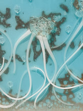Close-up of small Jellyfish showing white glass tentacles