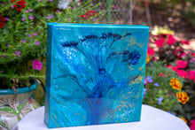 abstract fluid acrylic painting with vibrant blue green colors and flower