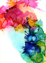 abstract splashes of rainbow colored alcohol ink