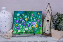 abstract multi color flower garden on green fluid background