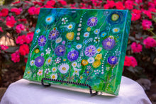 abstract multi color flower garden on green fluid background