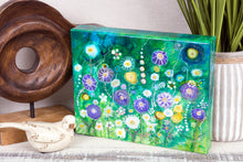 abstract multi color flower garden on green fluid background